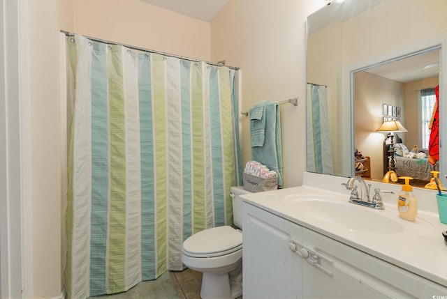 full bath with vanity, tile patterned flooring, and toilet