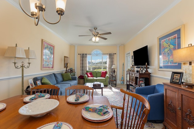 living room featuring crown molding and ceiling fan with notable chandelier