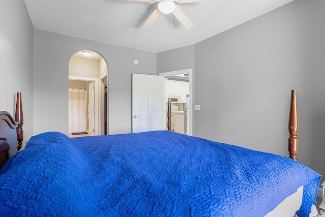 4503 W Harbour Ct Unit S-6, Little River, SC 29566 - bedroom featuring arched walkways, ceiling fan, and ensuite bath
