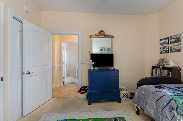 bedroom featuring light colored carpet