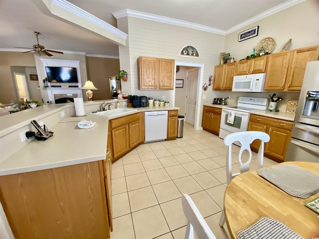 kitchen with light tile patterned floors, a peninsula, white appliances, a sink, and crown molding