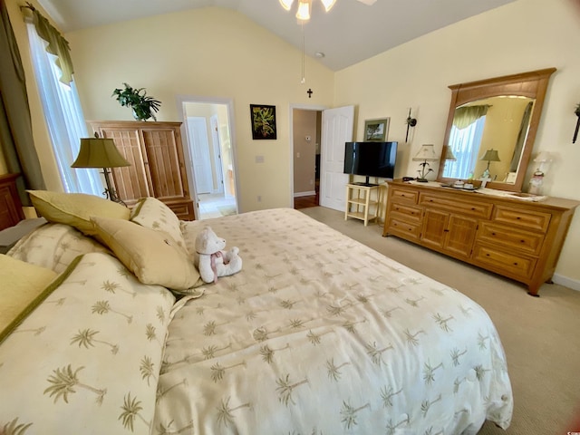 bedroom with light carpet and vaulted ceiling