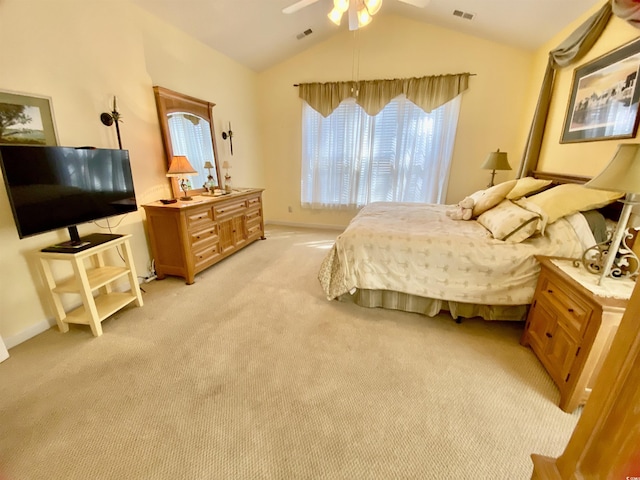 bedroom with lofted ceiling, ceiling fan, light carpet, and visible vents