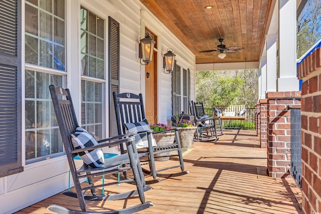 deck with a porch and a ceiling fan