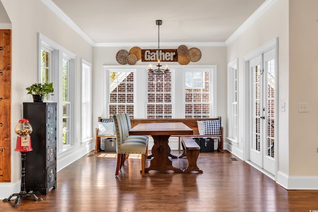 dining room with plenty of natural light, breakfast area, wood-type flooring, and crown molding