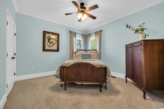 bedroom with light carpet, crown molding, and baseboards