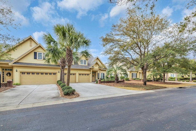 view of front of home with driveway and a garage