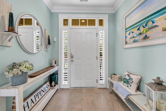 entrance foyer featuring visible vents and crown molding