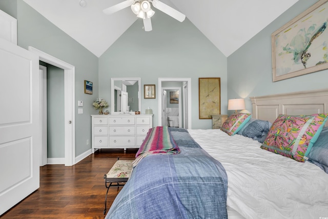 bedroom featuring high vaulted ceiling, wood finished floors, a ceiling fan, baseboards, and ensuite bath