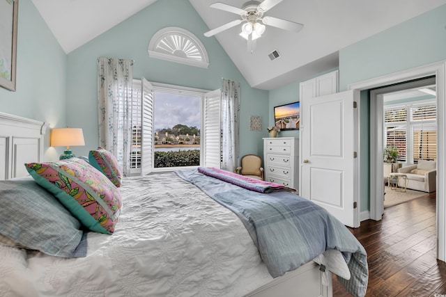 bedroom featuring dark wood-type flooring, visible vents, high vaulted ceiling, and a ceiling fan