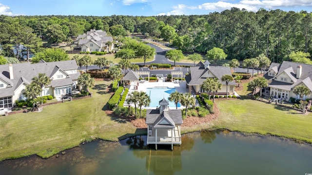 aerial view featuring a water view, a residential view, and a view of trees