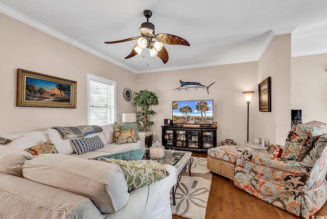 living area featuring ceiling fan, crown molding, and wood finished floors