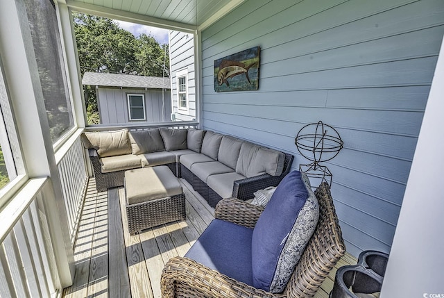 wooden terrace featuring outdoor lounge area