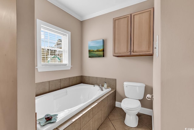 bathroom featuring toilet, baseboards, a bath, tile patterned floors, and crown molding