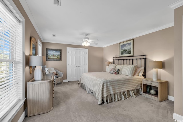 carpeted bedroom with ornamental molding, visible vents, and baseboards