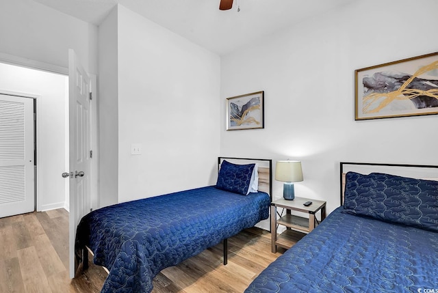 bedroom featuring wood finished floors and a ceiling fan