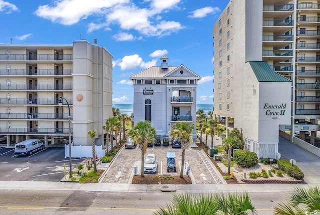 view of property featuring uncovered parking