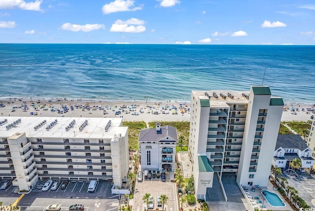 bird's eye view featuring a water view and a view of the beach