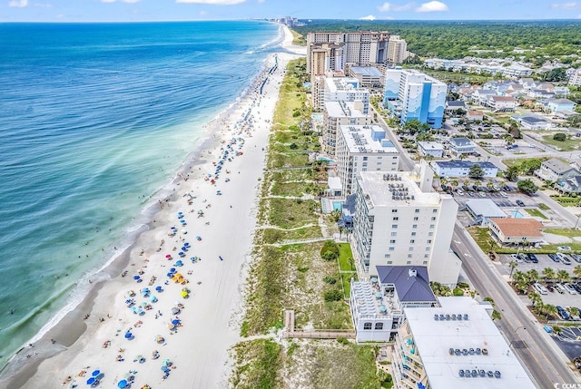 aerial view with a view of the beach, a water view, and a view of city