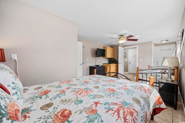 bedroom featuring light tile patterned floors and ceiling fan