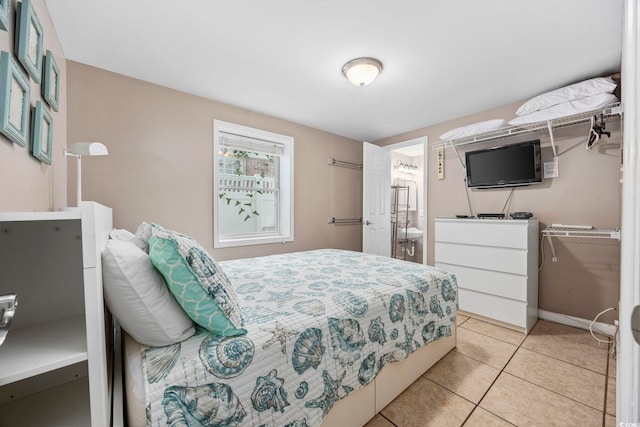 bedroom with light tile patterned flooring