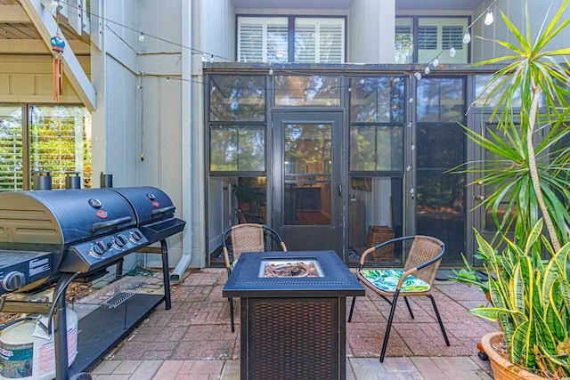 view of patio with a fire pit