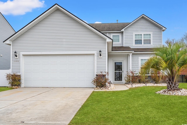 traditional-style home featuring a garage, a front yard, and concrete driveway