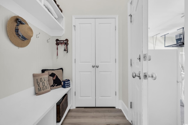 mudroom with light wood-style flooring