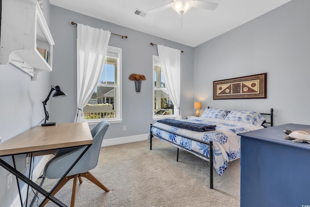 bedroom with a ceiling fan, carpet flooring, visible vents, and baseboards