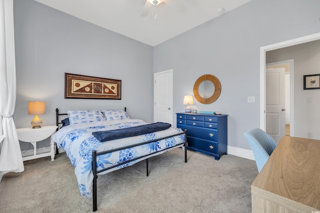 carpeted bedroom featuring ceiling fan and baseboards