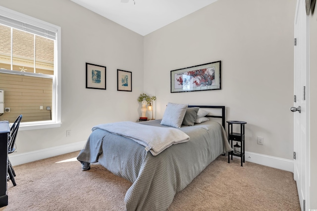 bedroom with carpet floors and baseboards