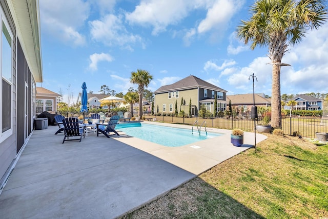 view of pool with a yard, fence, a fenced in pool, and a patio