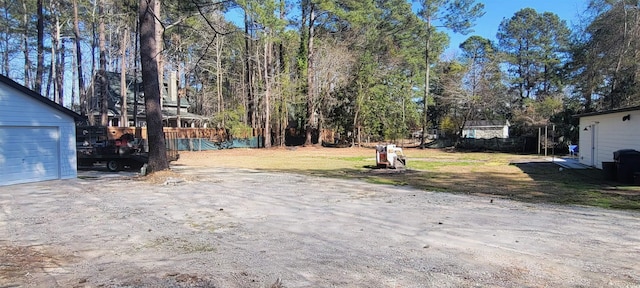 view of yard featuring a garage