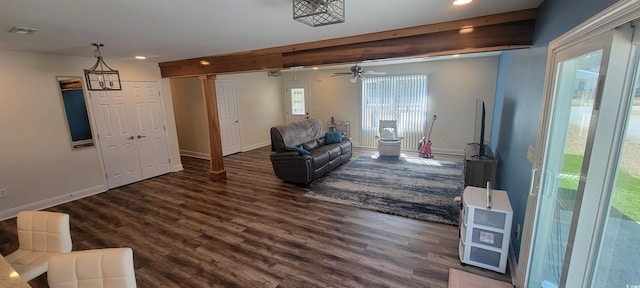 living area with dark wood-type flooring, recessed lighting, and baseboards