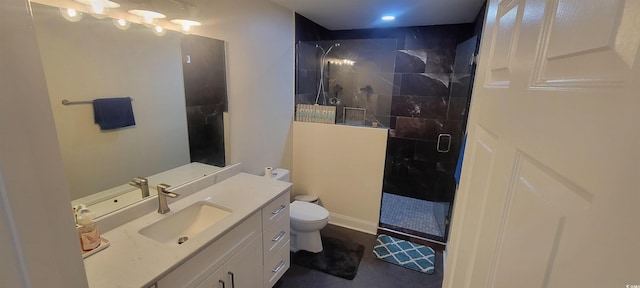 full bath featuring toilet, a shower stall, and vanity