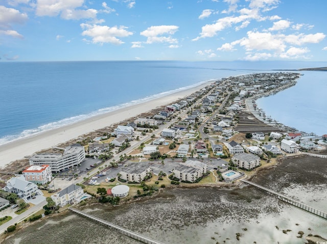 aerial view featuring a water view and a beach view