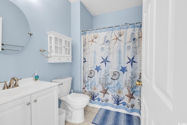 full bathroom featuring curtained shower, vanity, toilet, and tile patterned floors