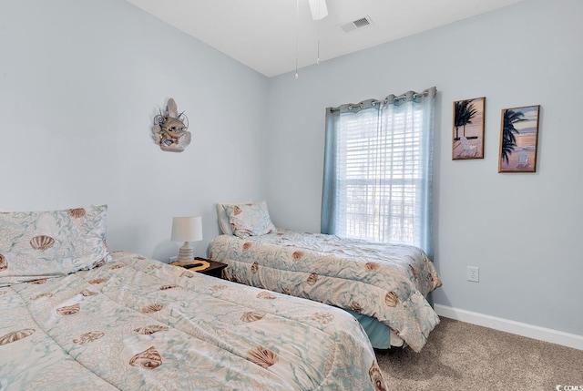 bedroom with ceiling fan, carpet, visible vents, and baseboards