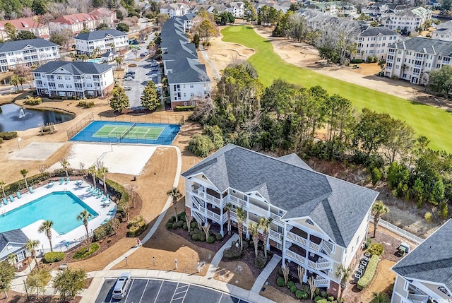 bird's eye view with a water view, a residential view, and golf course view