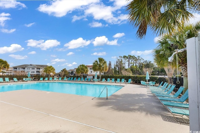 community pool with a patio