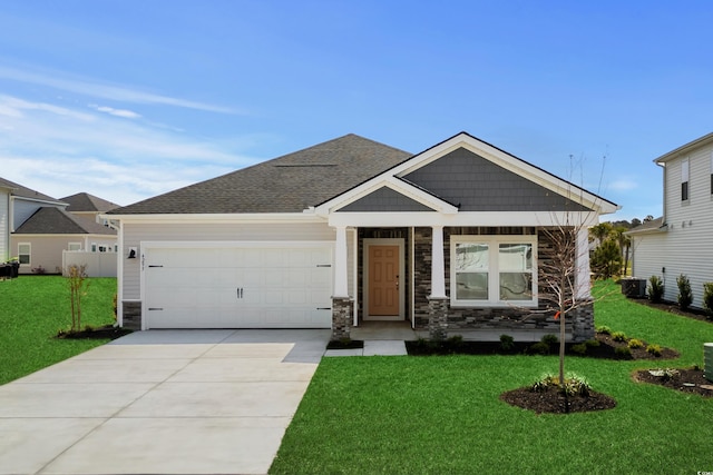 4295 Falls Oaks St, Myrtle Beach, SC 29579 - craftsman-style house featuring stone siding, a garage, concrete driveway, a front lawn, and roof with shingles