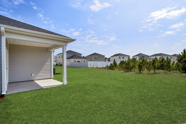 4295 Falls Oaks St, Myrtle Beach, SC 29579 - view of yard featuring a patio area, a residential view, and fence