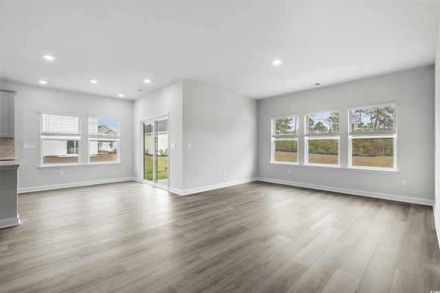 4295 Falls Oaks St, Myrtle Beach, SC 29579 - unfurnished living room with baseboards, wood finished floors, and recessed lighting