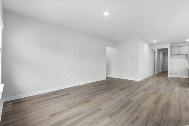 4295 Falls Oaks St, Myrtle Beach, SC 29579 - unfurnished living room featuring baseboards, visible vents, recessed lighting, and light wood-style floors