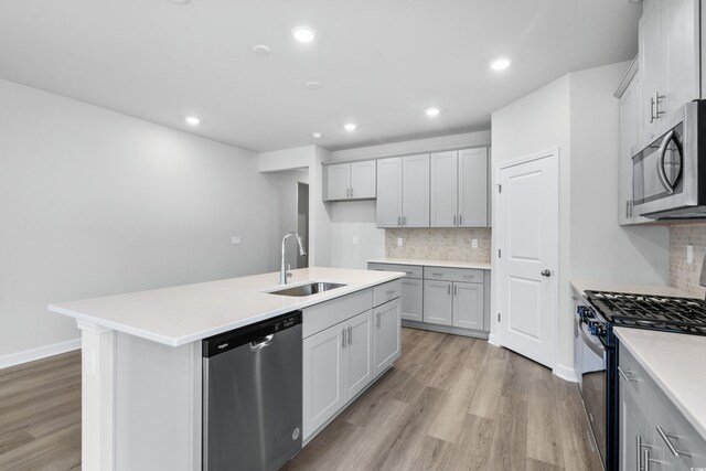 4295 Falls Oaks St, Myrtle Beach, SC 29579 - kitchen with recessed lighting, stainless steel appliances, a sink, an island with sink, and light wood finished floors