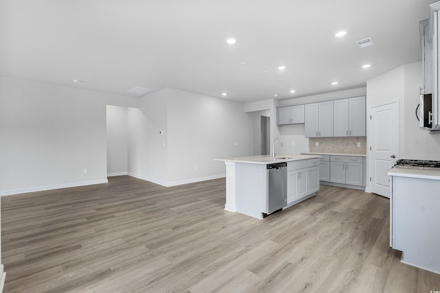 4295 Falls Oaks St, Myrtle Beach, SC 29579 - kitchen featuring open floor plan, light wood-type flooring, stainless steel appliances, a sink, and visible vents