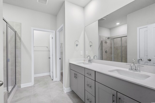 4295 Falls Oaks St, Myrtle Beach, SC 29579 - bathroom with a sink, a walk in closet, visible vents, and a shower stall