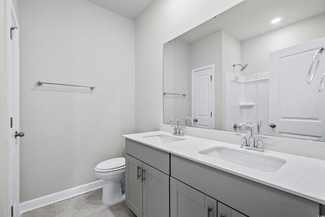 4295 Falls Oaks St, Myrtle Beach, SC 29579 - bathroom featuring toilet, a shower, tile patterned flooring, and a sink