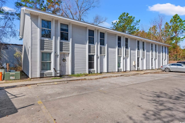 view of property with uncovered parking