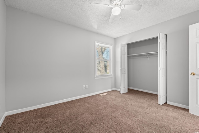 unfurnished bedroom with visible vents, ceiling fan, baseboards, carpet floors, and a closet